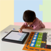 Thumbnail of kid playng the coding board game with blocks and whiteboard