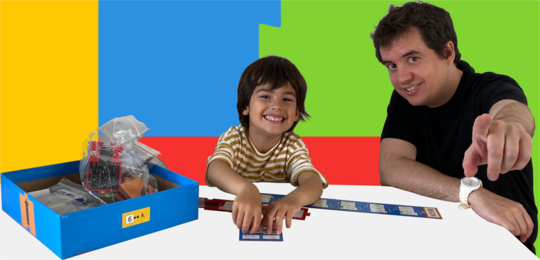 Father and son playing board game to teach coding